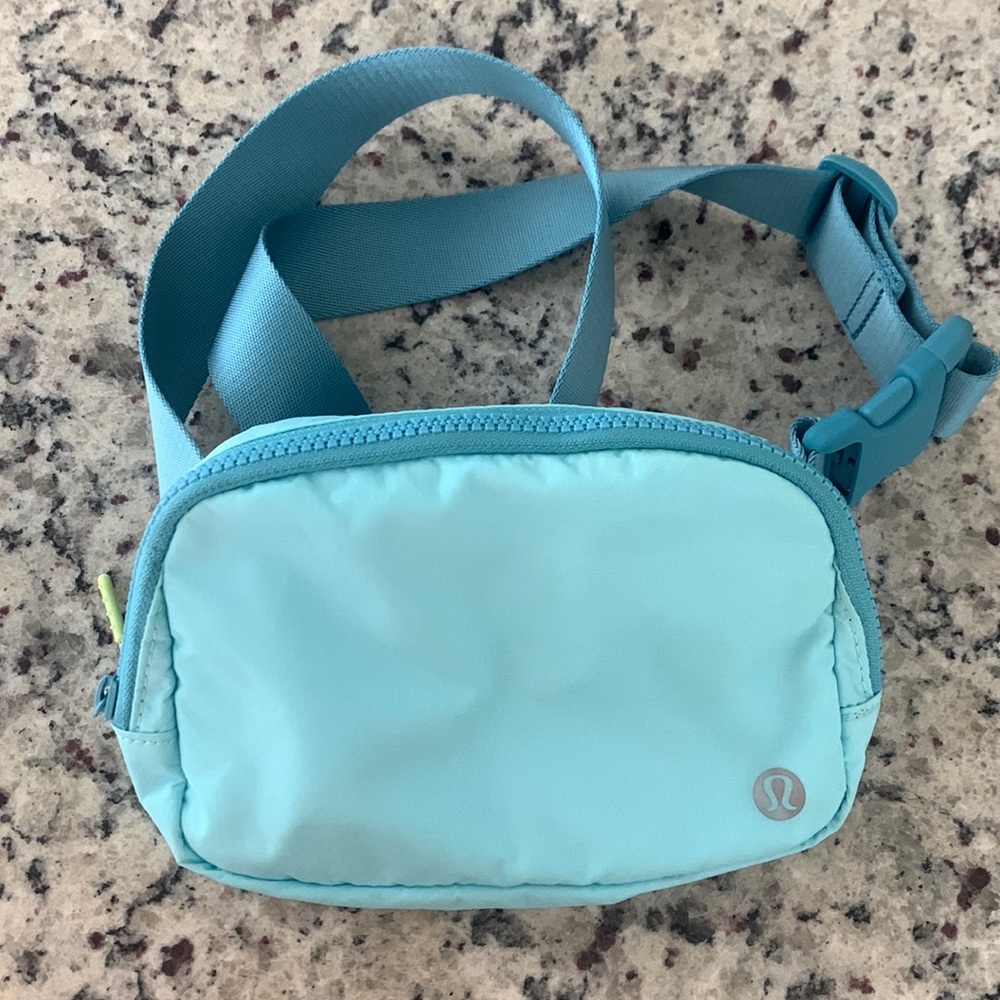 Like new aqua blue lululemon wear everywhere belt bag!